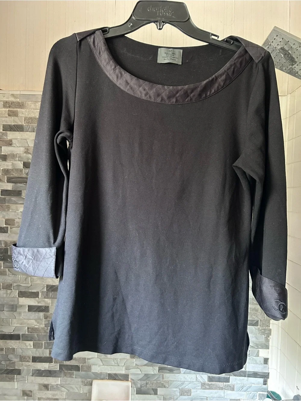 CHANEL black quilted boatneck employee uniform top